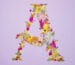Letter A made from colorful pressed flowers in a creative DIY art style