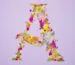 Letter A made from colorful pressed flowers in a creative DIY art style