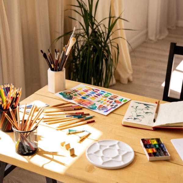 creative art workspace in warm sunlight, perfect for slow pressed flower art ideas and self-care rituals