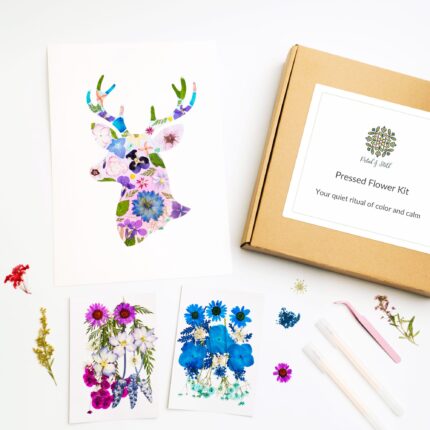 Flat lay of Petal & Still's Deer Pressed Flower Kit with dried flower art and calming DIY materials.
