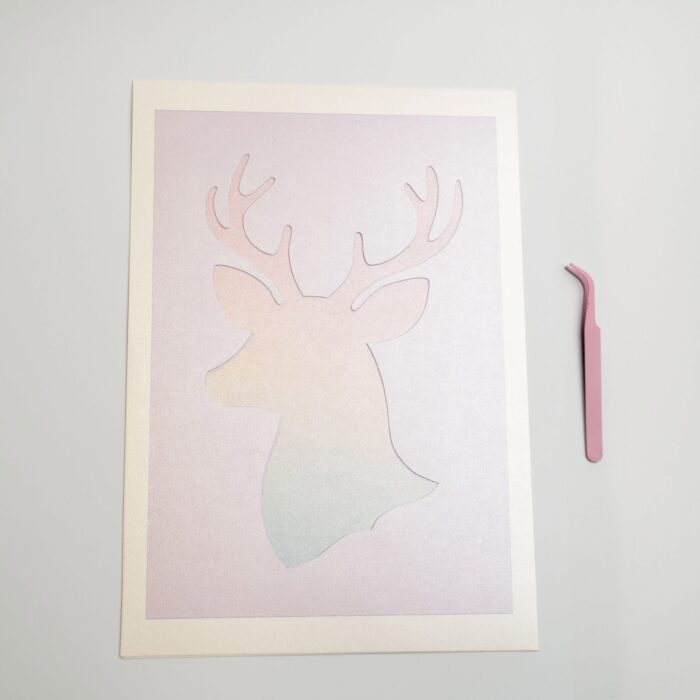 Deer silhouette template with soft pastel background included in the petal & still pressed flower kit.
