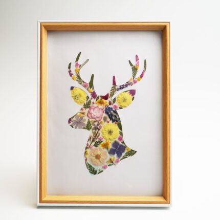 Framed deer pressed flower collage in warm yellow and pink tones, created with Petal & Still DIY kit.