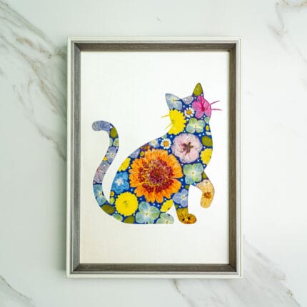 Pressed flower kit cat silhouette with blue background and orange, yellow, and pink flowers