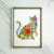Pressed flower kit cat silhouette with blue background and orange, yellow, and pink flowers