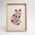 Pressed Flower Kit cat artwork in a natural wood frame – a floral silhouette collage shaped like a sitting cat, made with real dried flowers.
