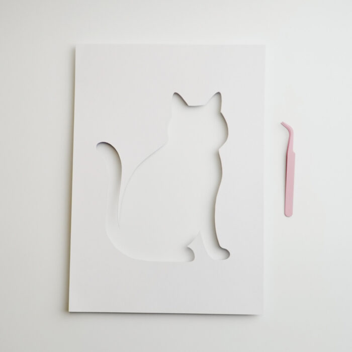 A cat cutout guide template for pressed flower art, designed to assist in creating unique floral cat designs.