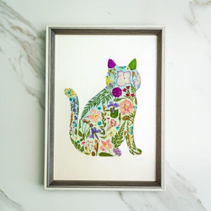 Pressed flower kit cat silhouette with pastel flowers and greenery