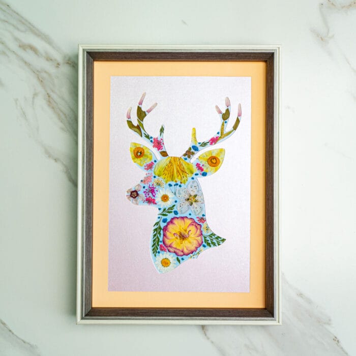 Pressed flower kit deer silhouette with pastel background and vibrant floral pattern