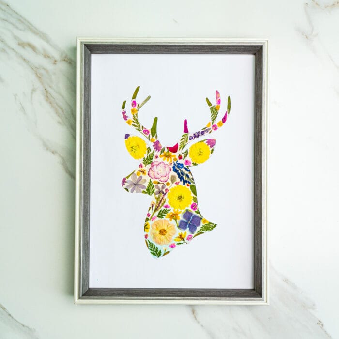 Pressed flower kit deer silhouette with bright yellow and purple flowers