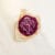 A handcrafted purple flower-shaped candle wrapped in kraft paper, included in the pressed flower kit as an ambient accessory.