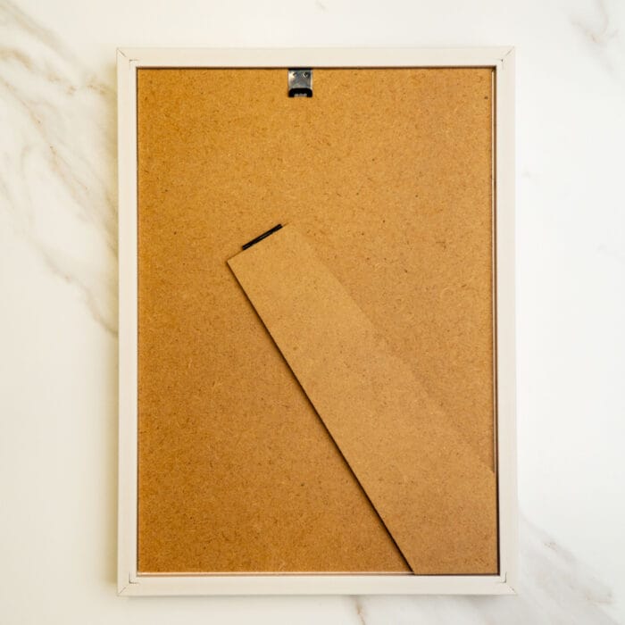 Back view of the pressed flower kit wooden frame, showing the built-in stand and hanging hardware.