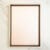 Front view of a wooden frame with a pastel pink background, ideal for displaying pressed flower collage art.