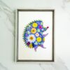 Pressed flower kit hedgehog silhouette with blue background and yellow, white, and pink flowers