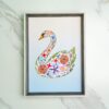 Pressed flower kit swan silhouette with delicate pressed flowers on blue gradient background