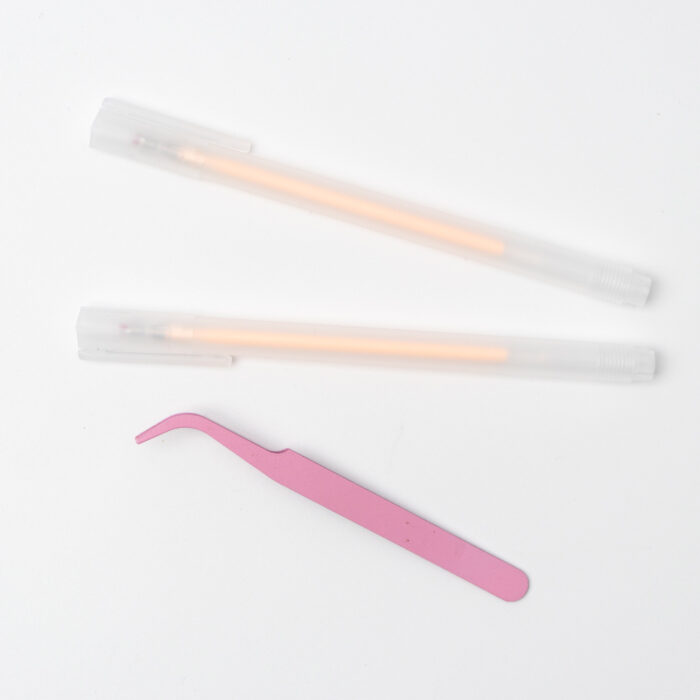 A set of tools for pressed flower art, including tweezers, glue pen, and other essentials for crafting floral designs.