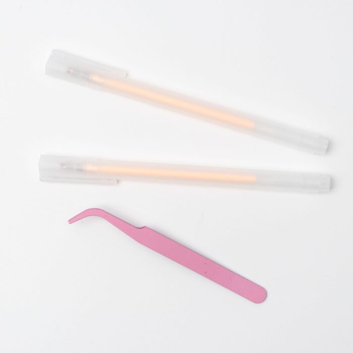 Pressed flower kit tools – pink tweezers and glue pens, designed for delicate floral collage crafting.