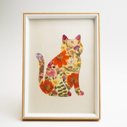 Floral cat artwork from the Cat Pressed Flower Kit — Watchful, featuring vibrant orange, pink, and yellow dried flowers in a wooden frame.