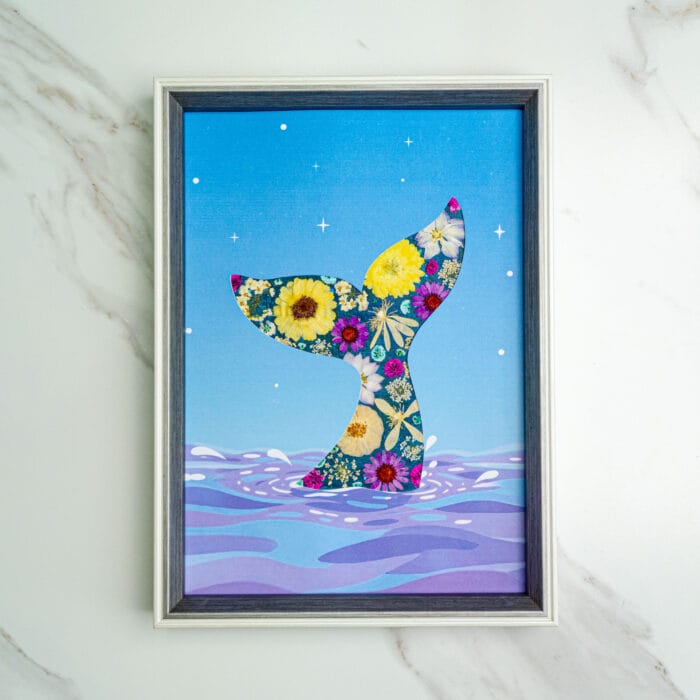 Pressed flower kit whale tail silhouette with yellow and purple flowers on starry blue background