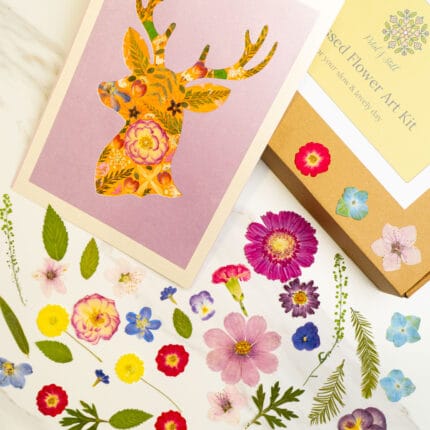 Completed deer silhouette art filled with colorful dried flowers from a pressed flower kit.