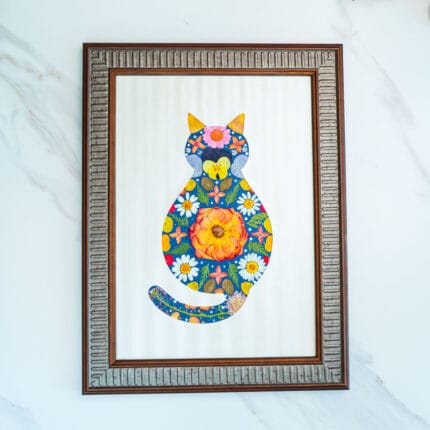 Pressed flower cat artwork with classic floral arrangement, centered daisy and colorful blossoms in frame