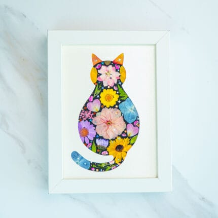 Pressed flower cat artwork with a midnight-inspired floral pattern, colorful blossoms on a dark base