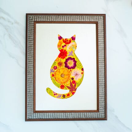Pressed flower cat artwork with warm sunny tones of yellow and orange, framed handmade floral design