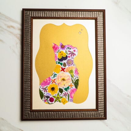 Pressed flower art cat silhouette filled with colorful blossoms, framed with a golden background.