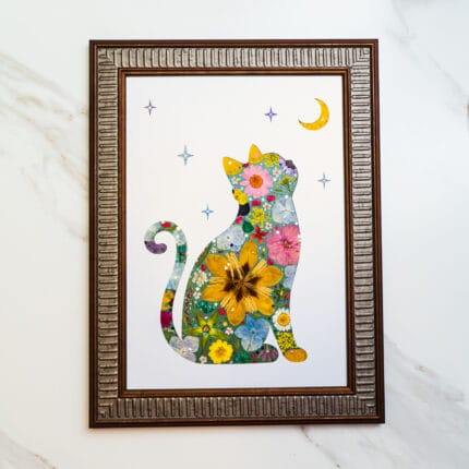 Pressed flower cat artwork filled with multicolored flowers, gazing at the moon and stars on a white background.